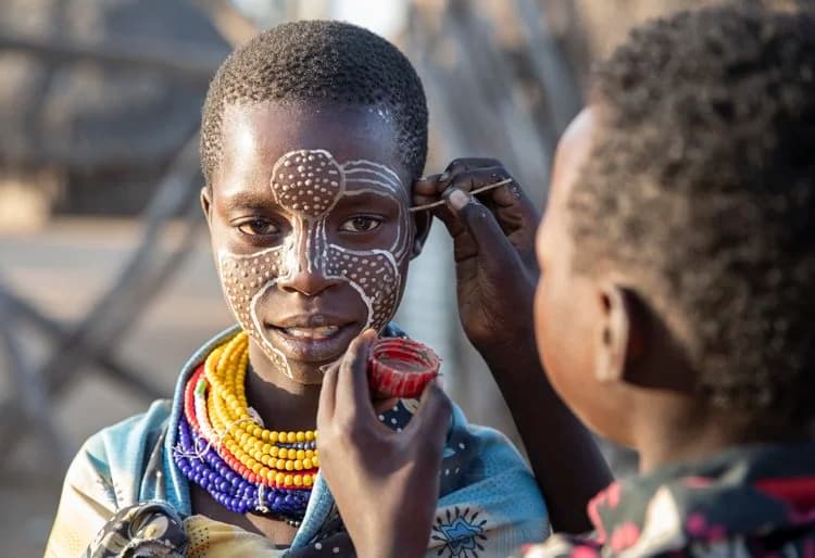 Karo tribe face and body painting tradition along the Omo River, Ethiopia