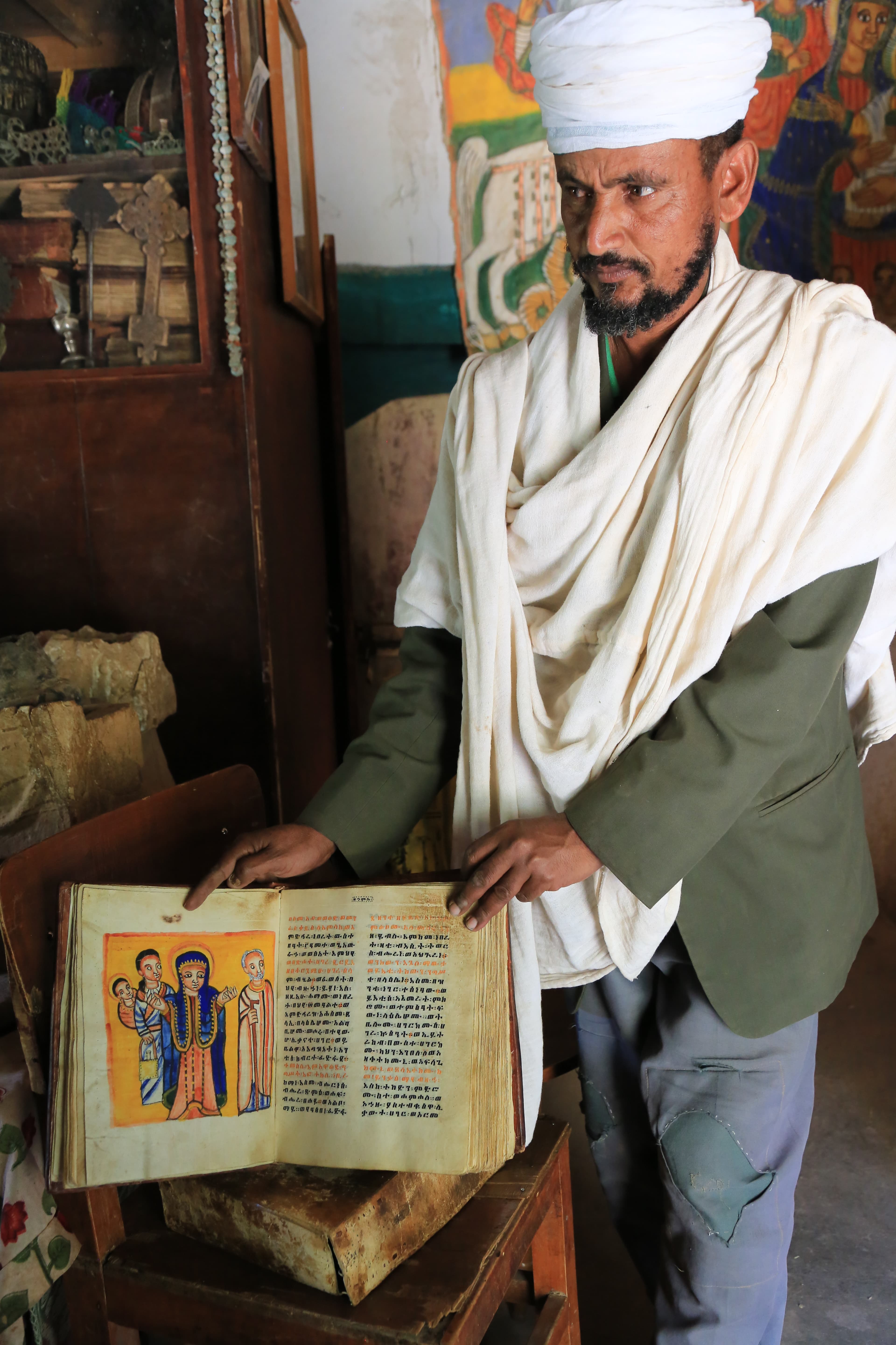 Priest with an illuminated manuscript in Lalibela, Ethiopia